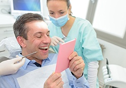 Patient looking at reflection during dental appointment
