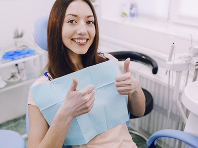Smiling patient in the dental chair