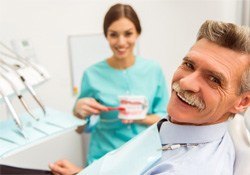 a patient smiling about dentures in Green Hills