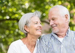 older couple smiling at each other 