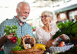 older couple shopping for healthy food together 