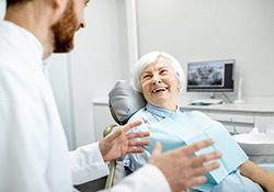 a patient discussing the cost of dentures in Green Hills