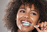 woman brushing teeth