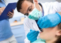 dentist examining a patient’s mouth