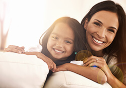 mother and daughter smiling