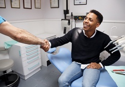 patient speaking to their dentist