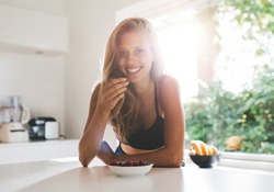 person smiling and eating