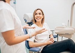 young woman talking to her dentist 