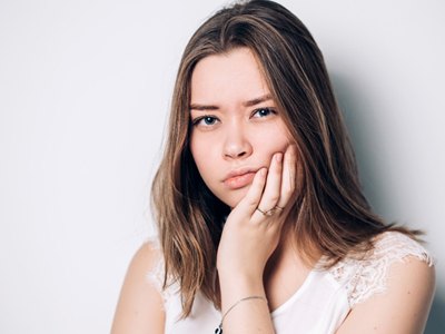 Woman holding jaw