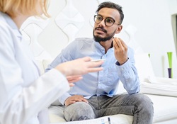 Man speaking with dentist