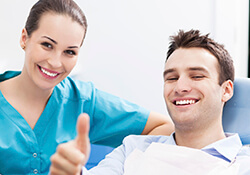 Male patient giving thumbs up