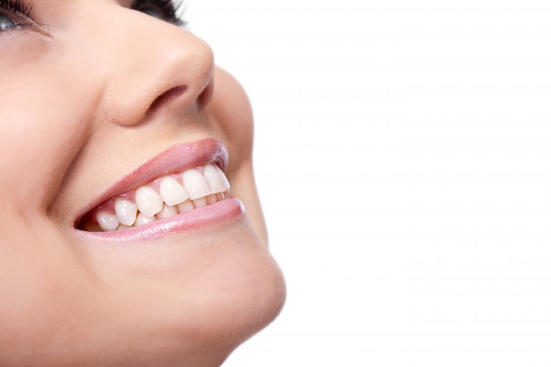 person smiling with bright bonded teeth