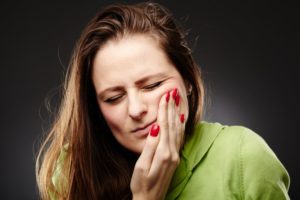 woman with cheek pain