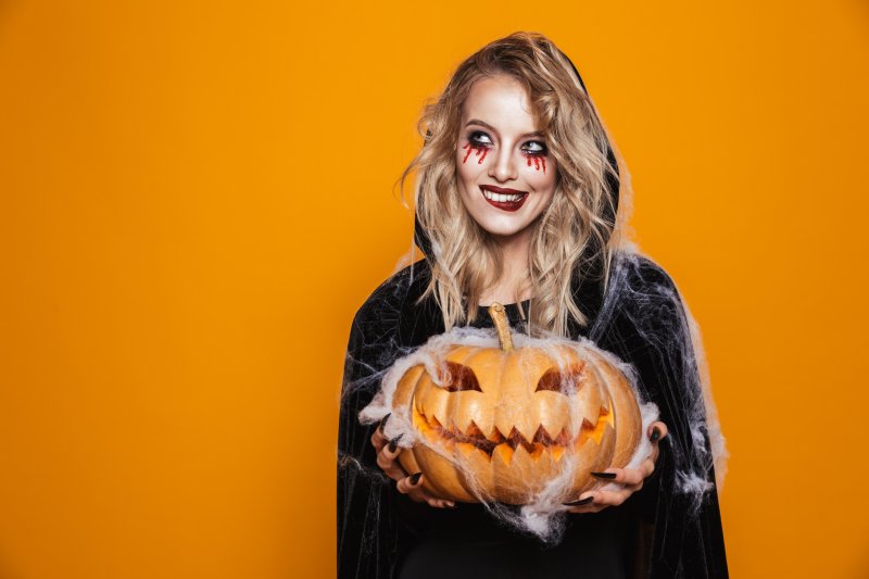 A girl in costume smiling with good dental hygiene