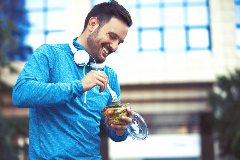Man eating for good oral hygiene and working out for heart health