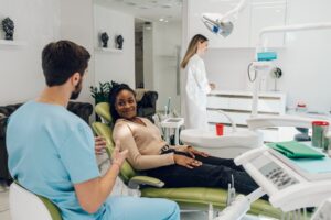 a person speaking with a cosmetic dentist